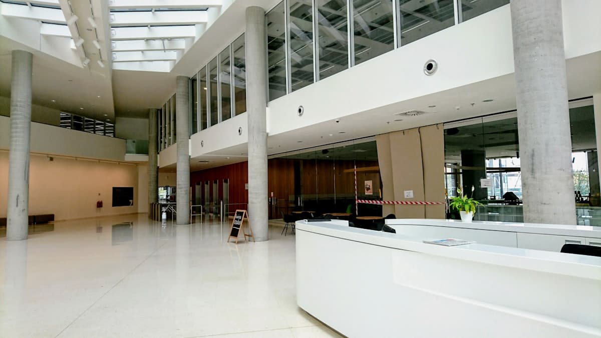 A bright white public building interior